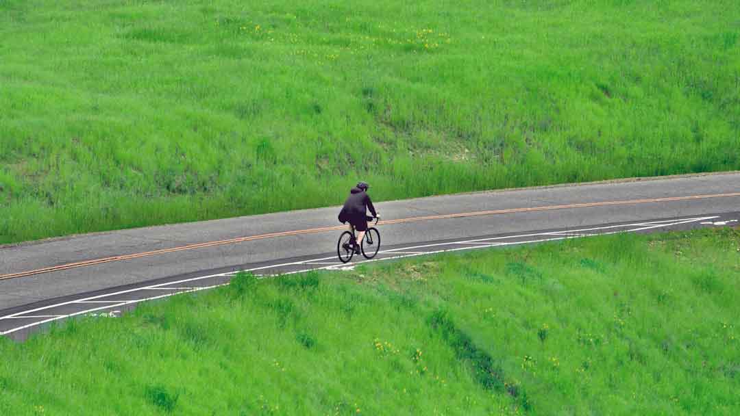 Cyclist riding a carbon bike on a scenic route