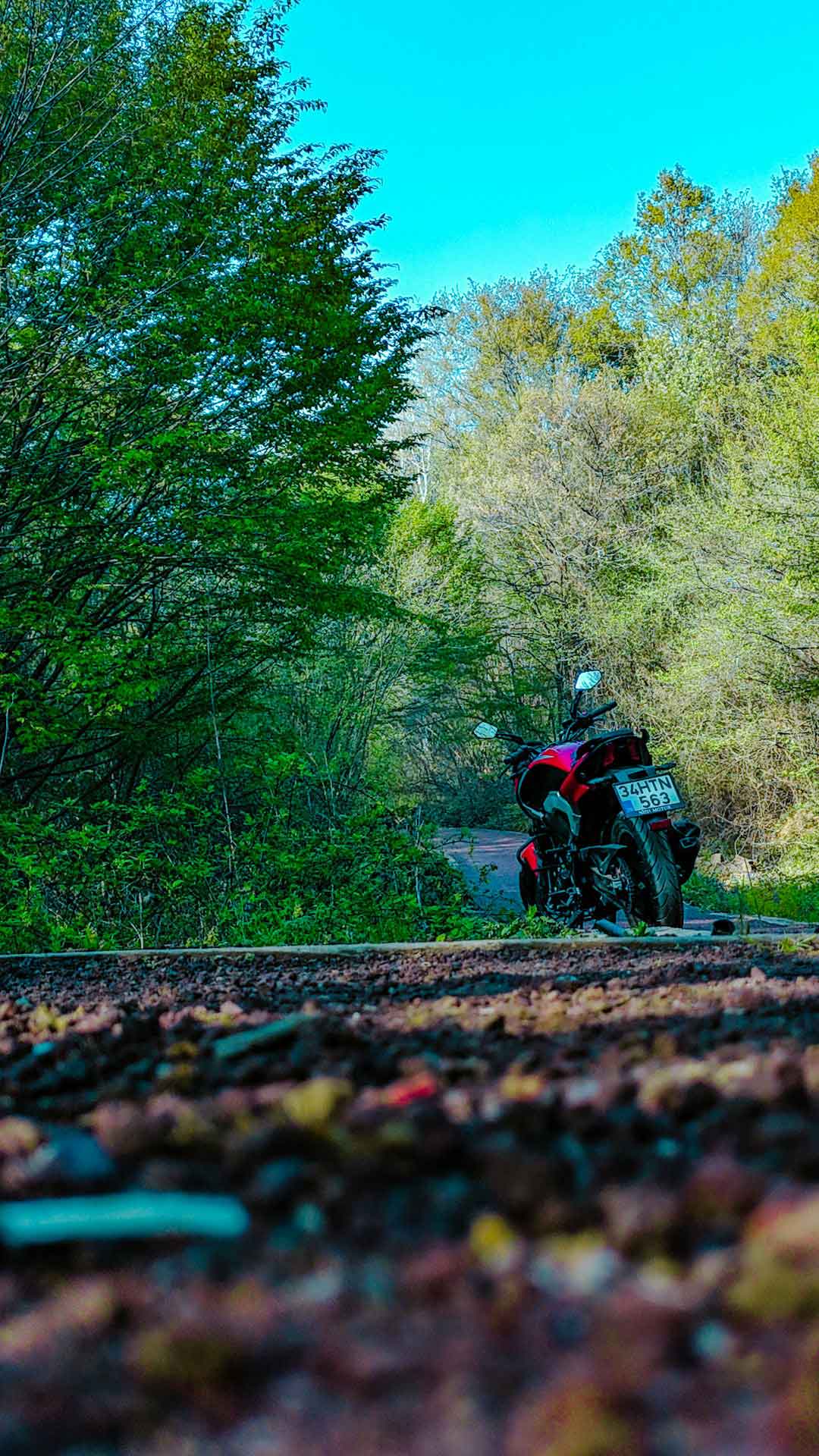 Biker on a gravel path with a scenic background