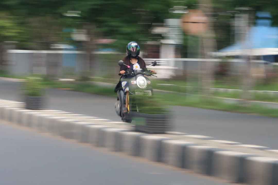 A person enjoying a ride on a lightweight foldable electric bike