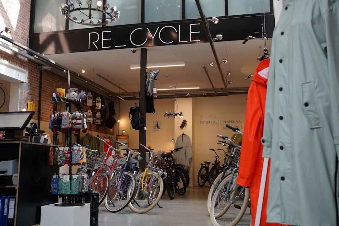 A cyclist selecting a bike frame in a store