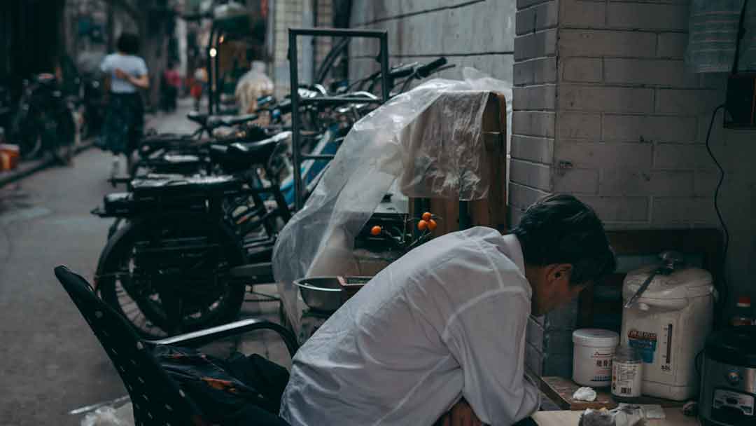 Person cleaning a carbon bike frame