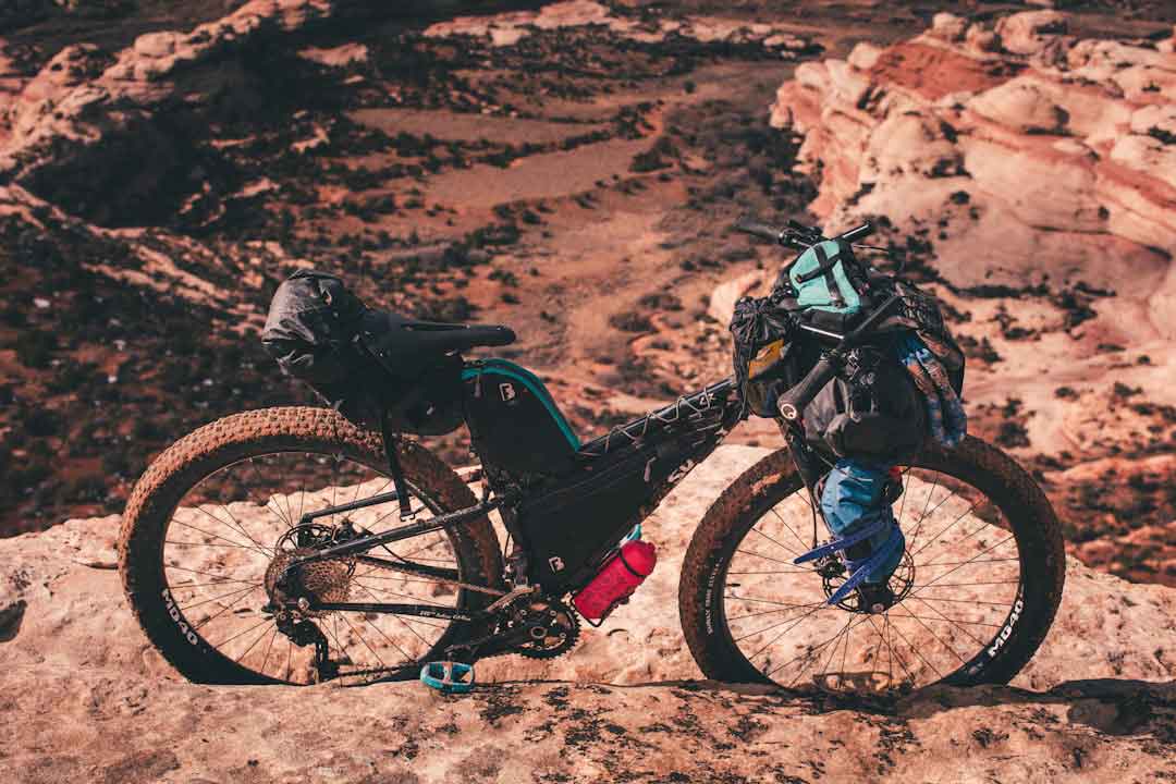 mountain biker deciding between two bikes