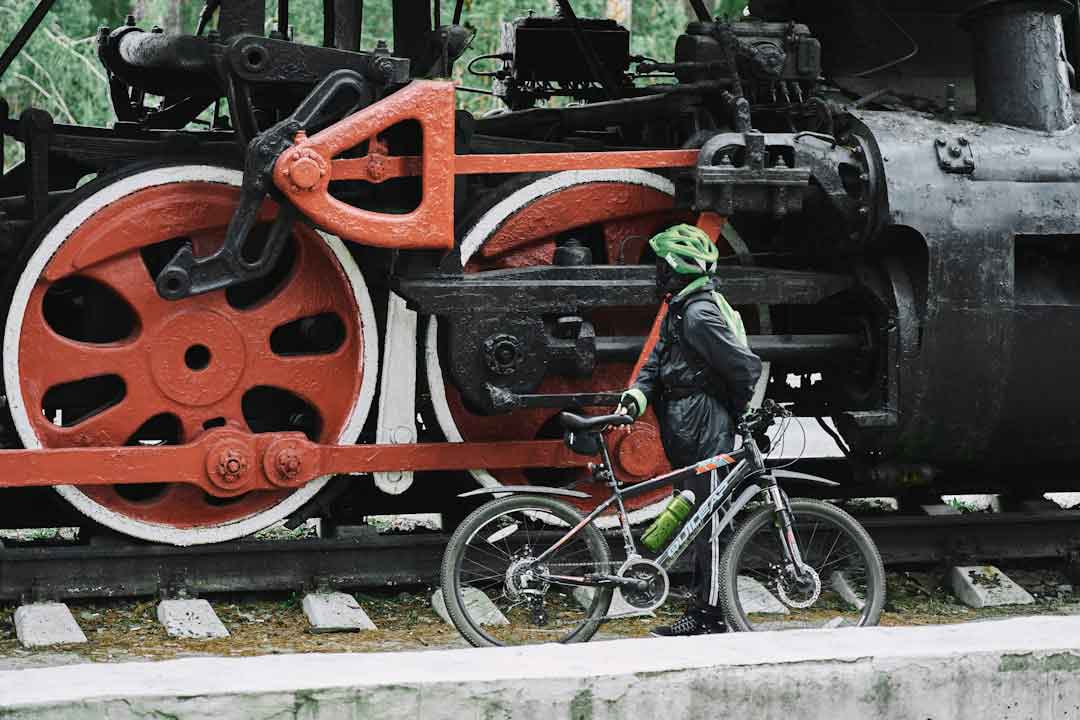 Biker performing maintenance on a mountain bike