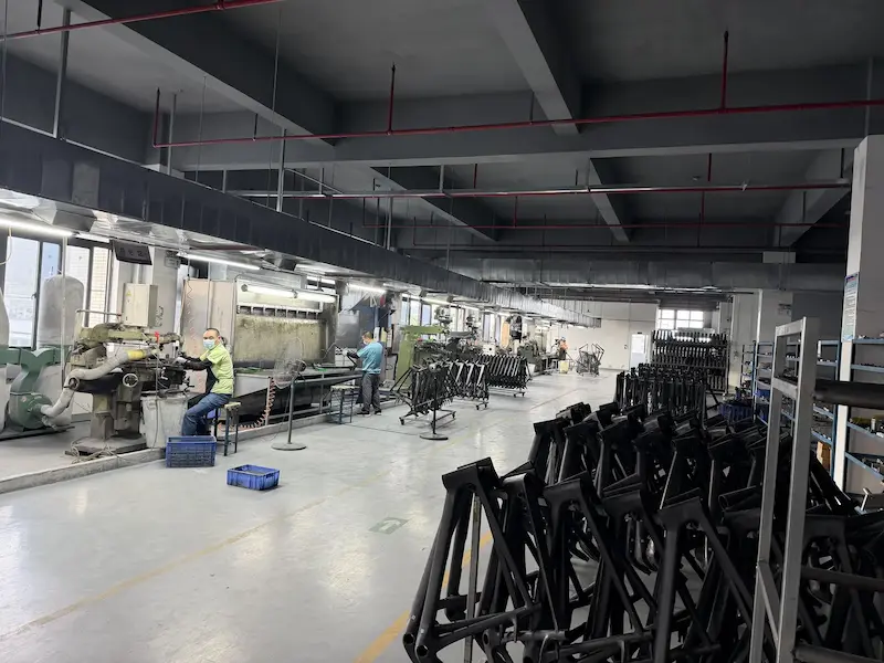 Carbon frame assembly hall with frames on racks