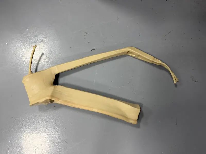 Carbon frame preform wrapped and taped ready for molding