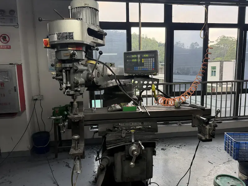 Milling station machining a carbon bike frame interface