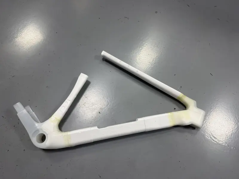 Carbon frame front triangle preform after layup and wrapping