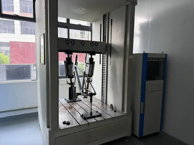 Carbon bike frame clamped in a test fixture for a static load test